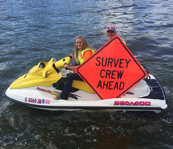 A two person survey crew on a wave runner